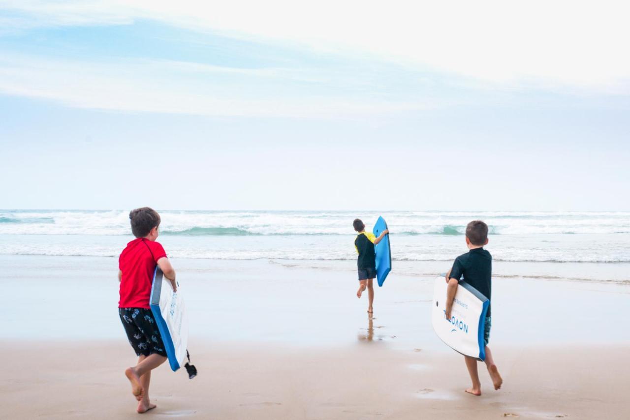 Novotel Chennai Sipcot Екстер'єр фото Children learning to surf at the beach